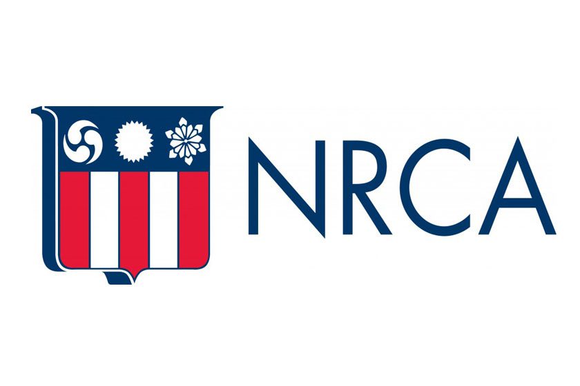 The nrca logo on a white background featuring a metal element.